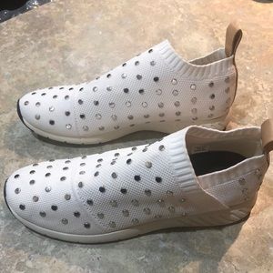 Slip on sneakers with studs